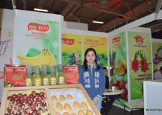 Ms. Nguyen Bao Trang from Doveco. She is proudly presenting her fruit products at the booth.